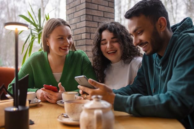 A group of young adults is gathered around a table, each holding a smartphone and looking at the screen with expressions of excitement and engagement. The scene suggests they are actively participating in a social media campaign, possibly related to a new movie release. The room is brightly lit and modern, emphasizing the contemporary nature of social media marketing.