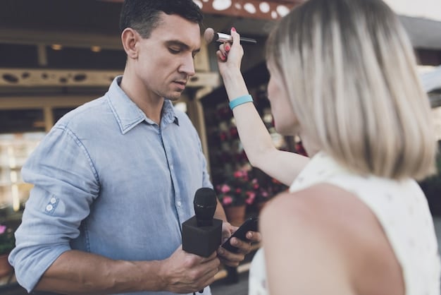 A makeup artist carefully applying makeup to [Actor's Name]'s face on set, with the director and camera crew visible in the background, capturing the behind-the-scenes action.