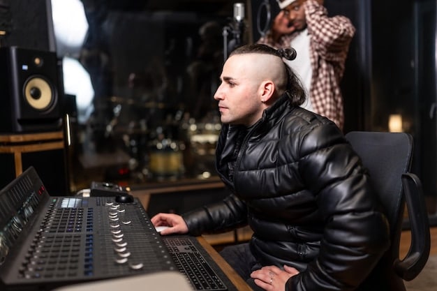 A close-up shot of a sound engineer working at a mixing console, surrounded by monitors displaying waveform visualizations and audio tracks. The engineer is focused and wearing headphones, suggesting the meticulous attention to detail involved in sound design.