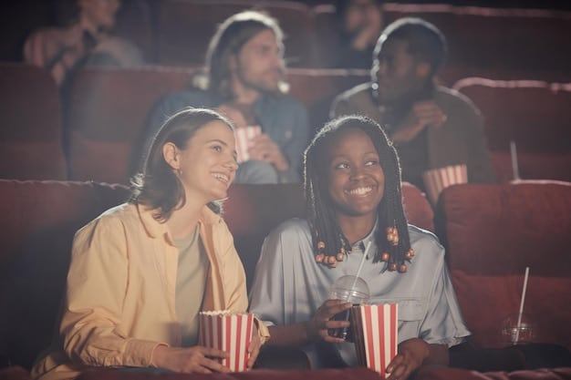 A group of diverse audience members laughing in a movie theater, representing the modern demand for inclusive and relatable humor in comedies.