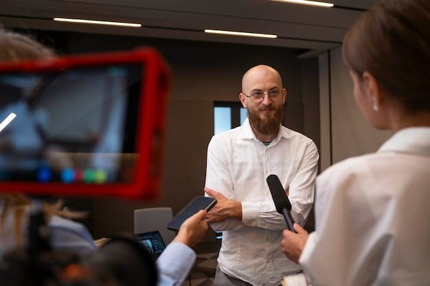 A candid shot of the director giving instructions to the lead actor during a pivotal emotional scene. The actor is deeply focused, and the director is gesturing emphatically, conveying the intensity of the moment.