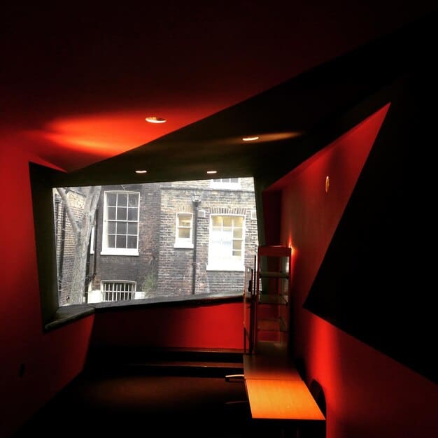 A split screen showing a traditional movie theater on one side and a modern home theater setup with a large screen and streaming options on the other.