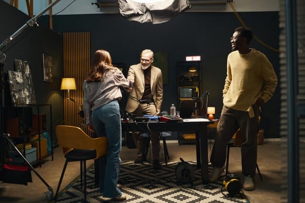 A director on an independent film set, surrounded by a small crew. The atmosphere is creative and collaborative, but also tense due to budget constraints.