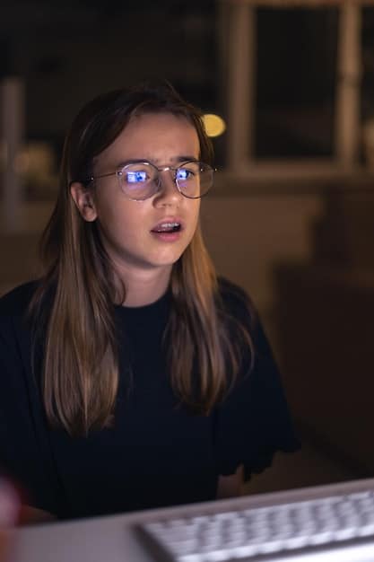 A close-up shot of a showrunner's face, intensely focused, working on a script late at night. The lighting is dim and the room is cluttered with papers and notes, conveying the dedication and pressure involved in crafting a compelling season finale.
