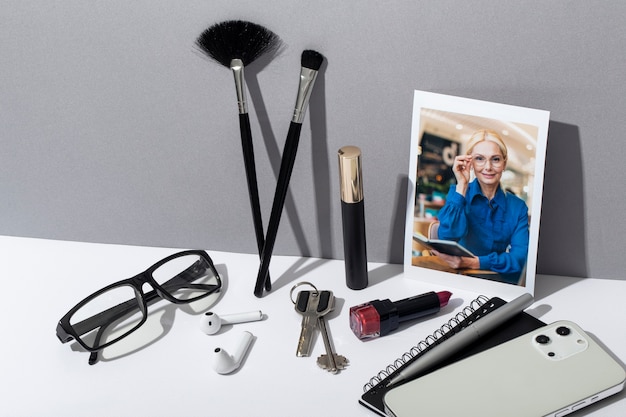 A well-organized makeup station on a film set. Various brushes, palettes, prosthetic pieces, and other tools are neatly arranged. The setup shows the breadth and complexity of the makeup artist's toolkit.