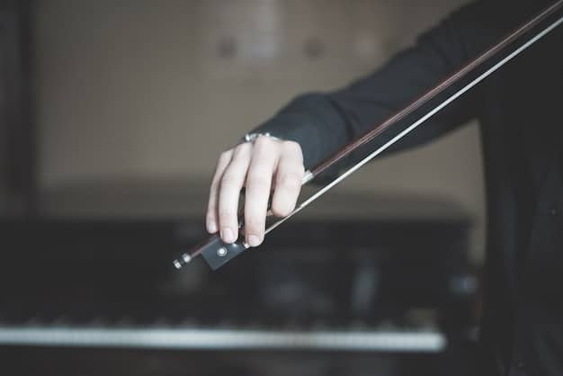 A close-up of a conductor's hands passionately leading an orchestra, with a blurred background of musicians playing their instruments. The lighting focuses on the conductor's expressive gestures.